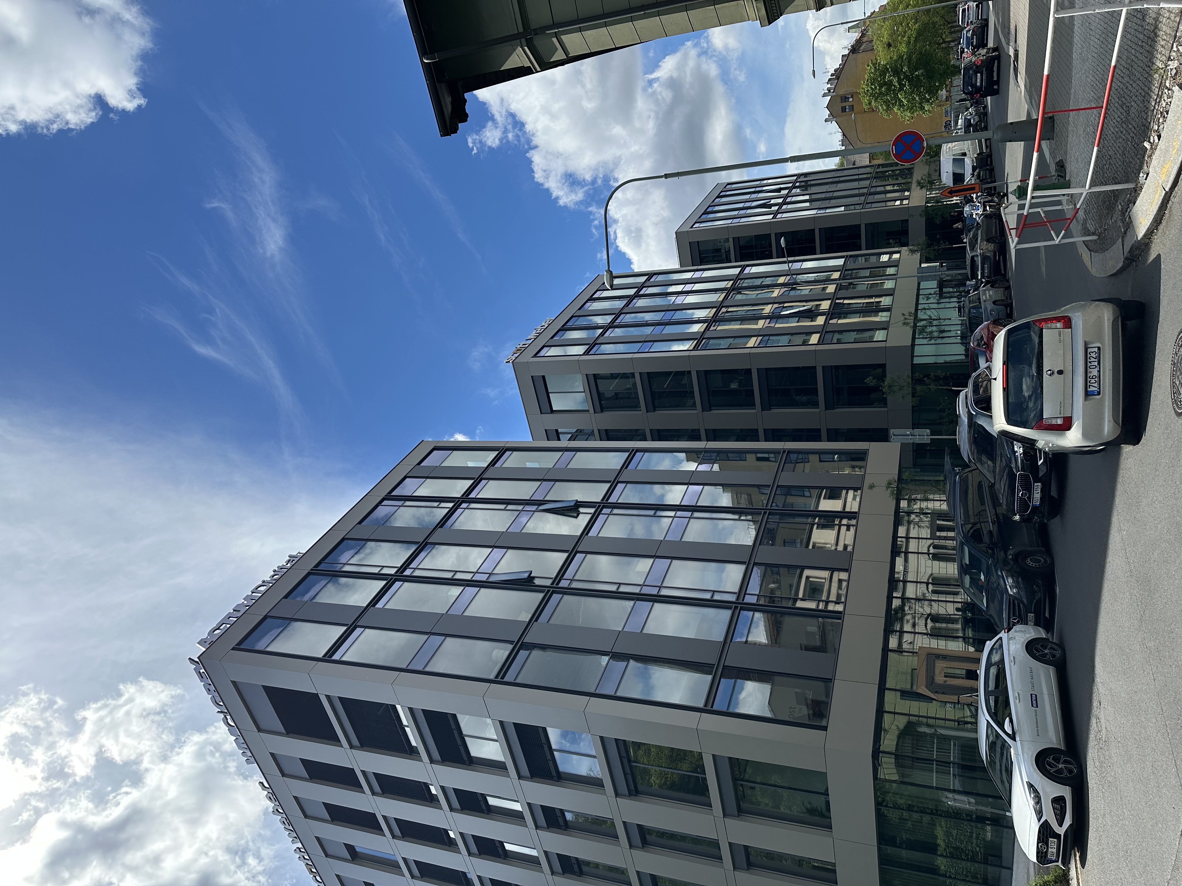 Modern office buildings with raw ultrawide distortion at edges
